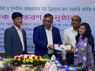 Dhaka Ahsania Mission representative receiveing grants from Honourable Home Minister